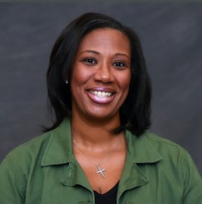 President Coleman is pictured in a green shirt with a gray background.